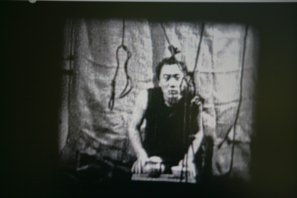 Alexander Ugay
<br><em>Tea Ceremony</em>, 2001
<br>Still from video on 8 mm film
<br>Duration: 2:00