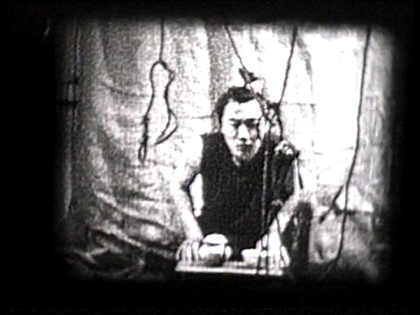 Alexander Ugay
<br><em>Tea Ceremony</em>, 2001
<br>Still from video on 8 mm film
<br>Duration: 2:00